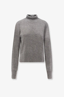 Toteme women’s cashmere turtleneck sweater in soft heathered gray with fine knit texture and ribbed cuffs