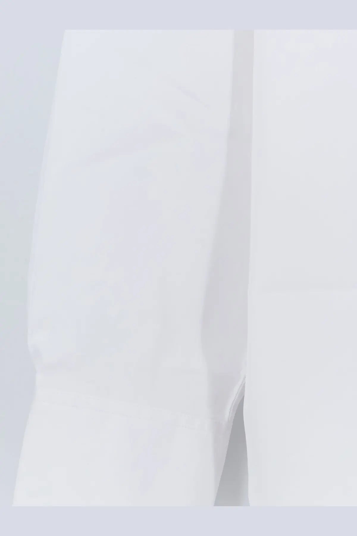 White cotton fabric sleeve with subtle texture and clean seam detail from toteme women’s cotton shirt white