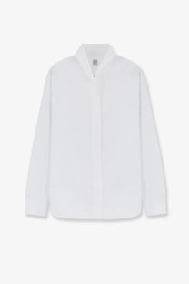 Toteme women’s white cotton button up shirt with minimalist design and subtle texture