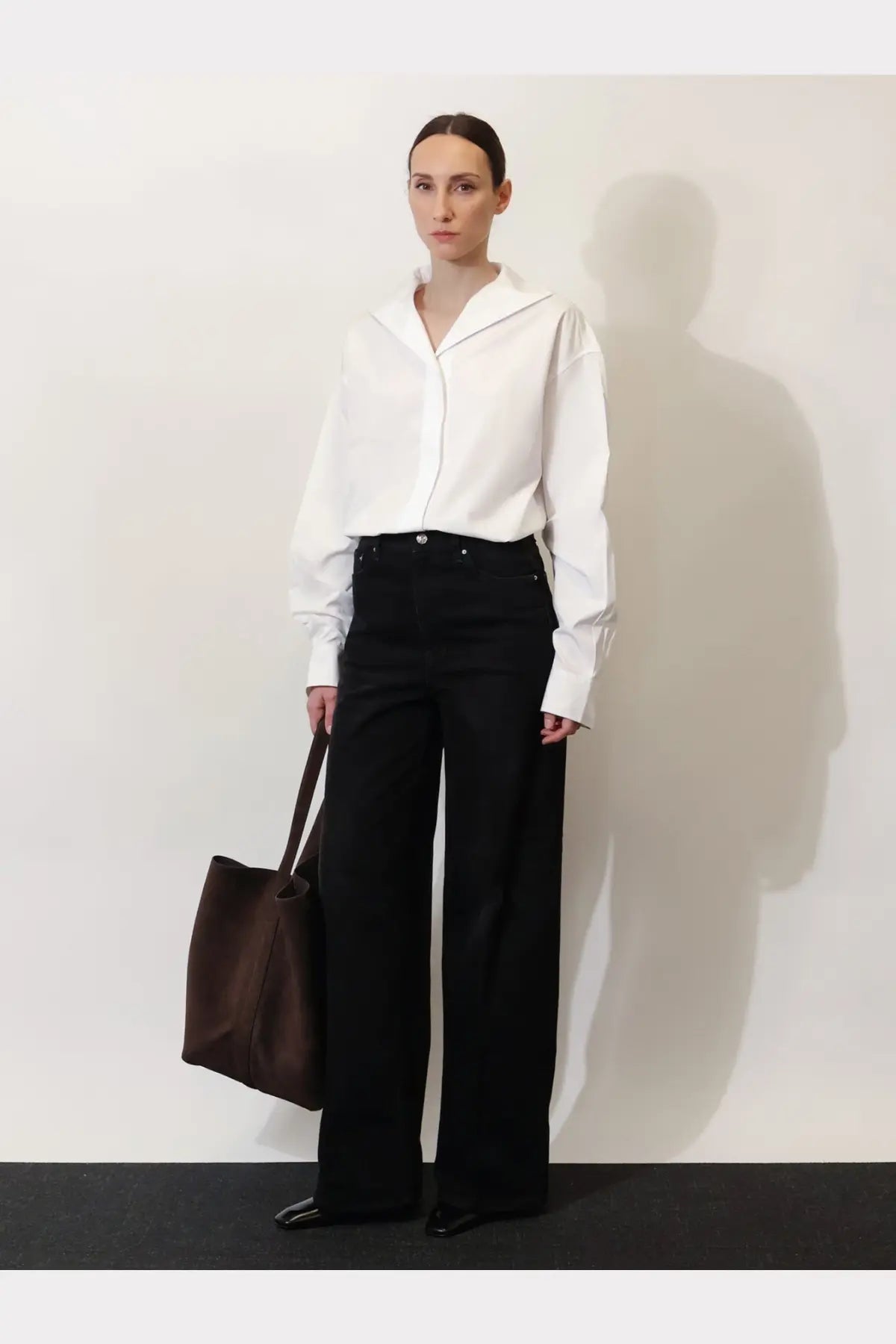 Toteme women’s white cotton shirt featuring an oversized collar, long sleeves, and minimalist design
