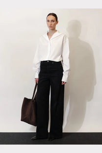 Toteme women’s white cotton shirt featuring an oversized collar, long sleeves, and minimalist design