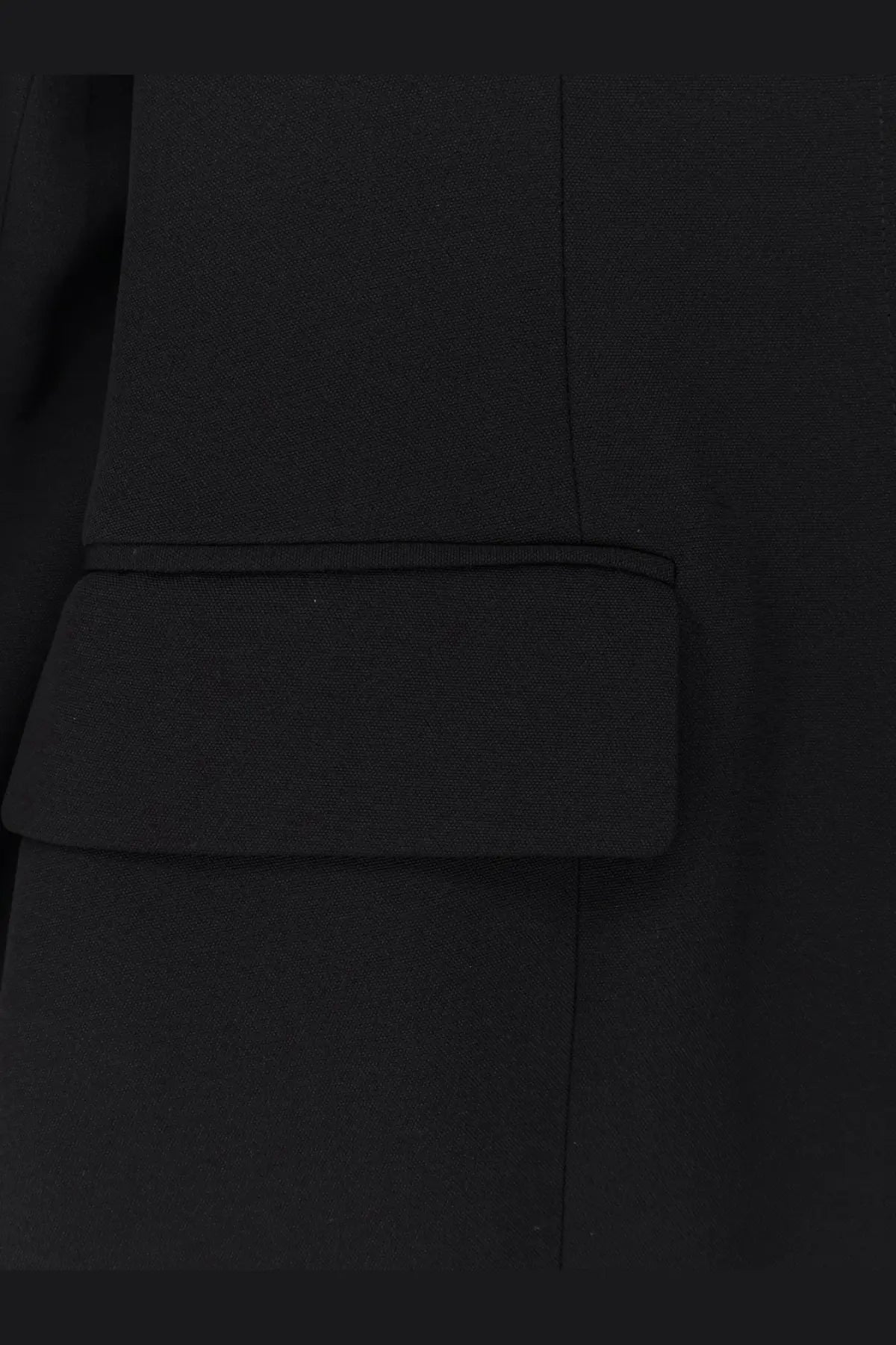 Toteme women’s evening black viscose blend blazer showing black textured fabric pocket flap with precise stitching
