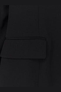 Toteme women’s evening black viscose blend blazer showing black textured fabric pocket flap with precise stitching