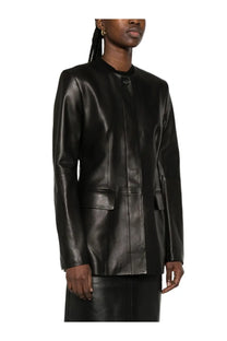 Toteme women’s black leather blazer with sleek minimalist design and subtle stitching details