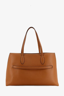 Tan pebbled leather tote bag by Toteme with structured handles and front flap detail for versatile use