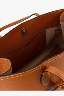 Toteme women’s leather shoulder bag in tan with beige interior and white stitching designed as a tote bag