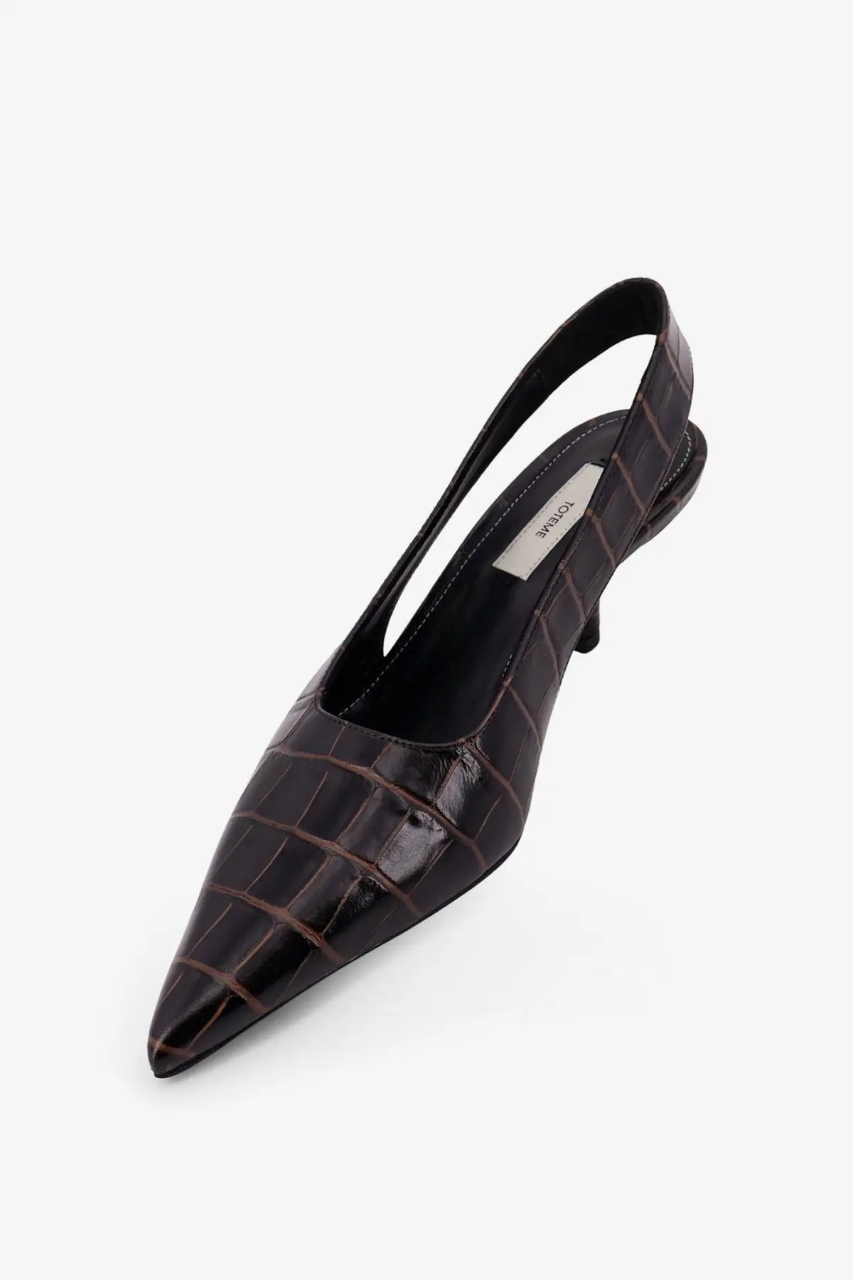 Toteme women’s dark brown croc-embossed leather slingback pump with a slender heel shown from the back side