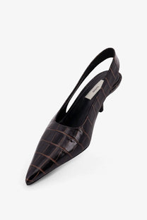 Toteme women’s dark brown croc-embossed leather slingback pump with a slender heel shown from the back side