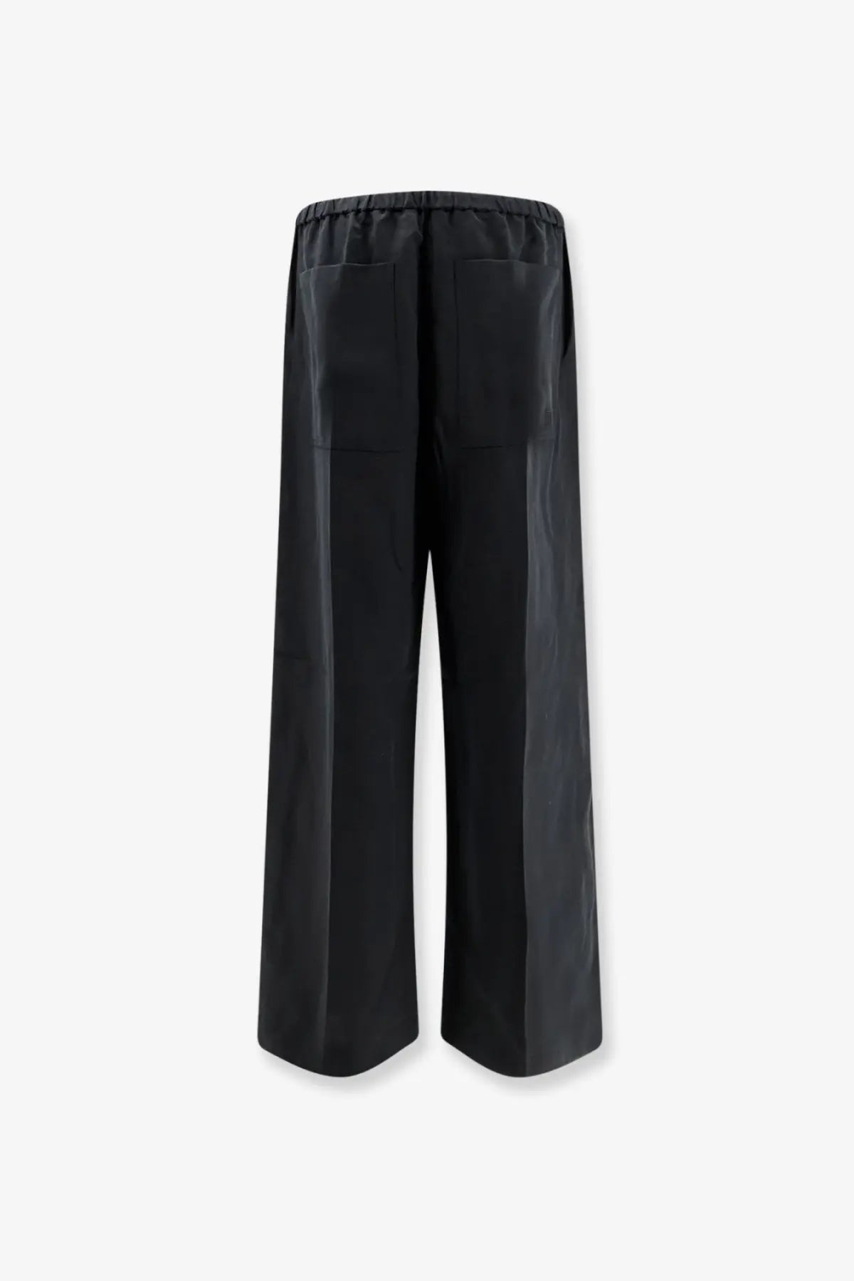 Back view of toteme women’s black linen and lyocell blend wide-leg trousers with elastic waistband and rear pockets
