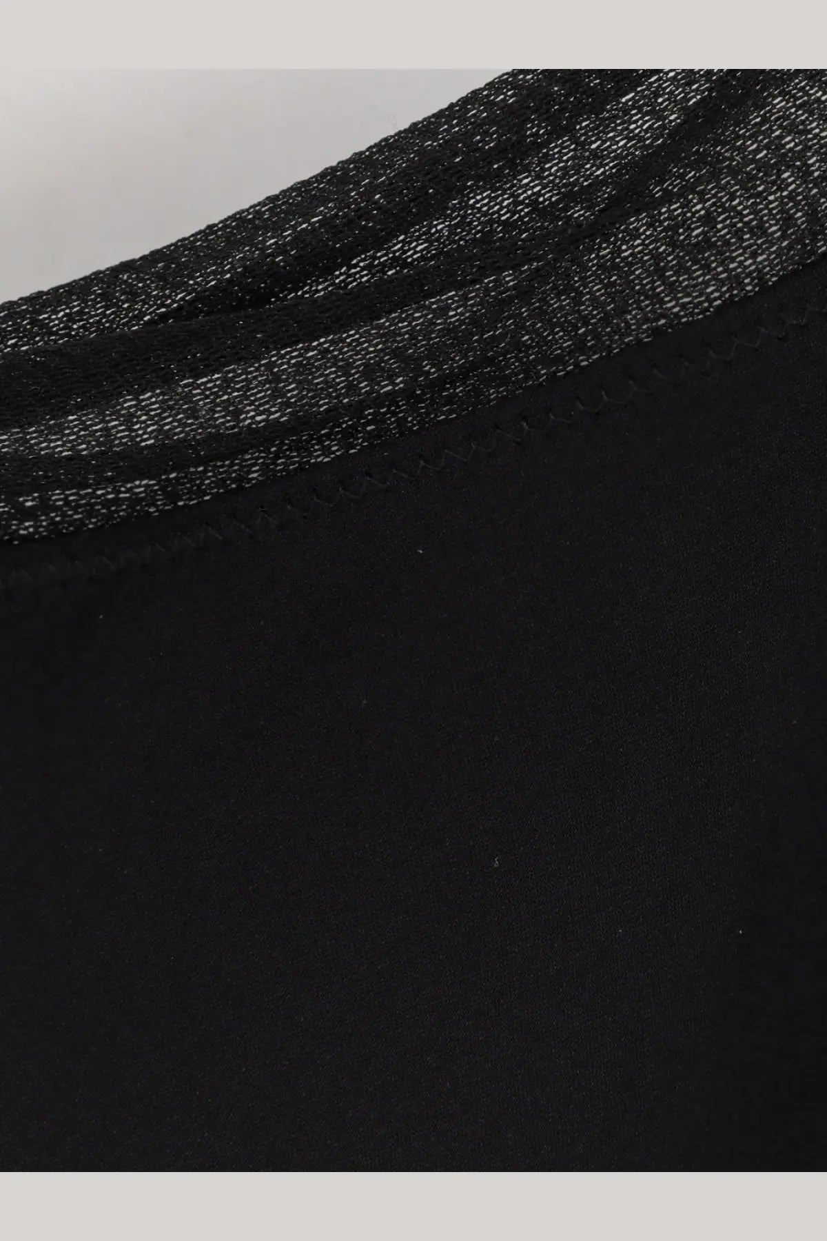 Black mesh fabric with subtle shimmer and fine stitching along the neckline on Toteme women’s long silk dress black