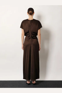 Toteme women’s long viscose dress in brown features a sleek satin maxi design with short sleeves and a fitted waist