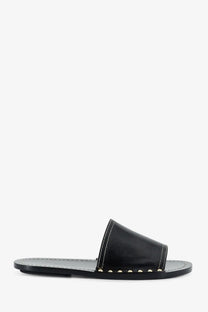 Toteme women’s black leather slide sandal with silver studs along the strap for stylish casual wear