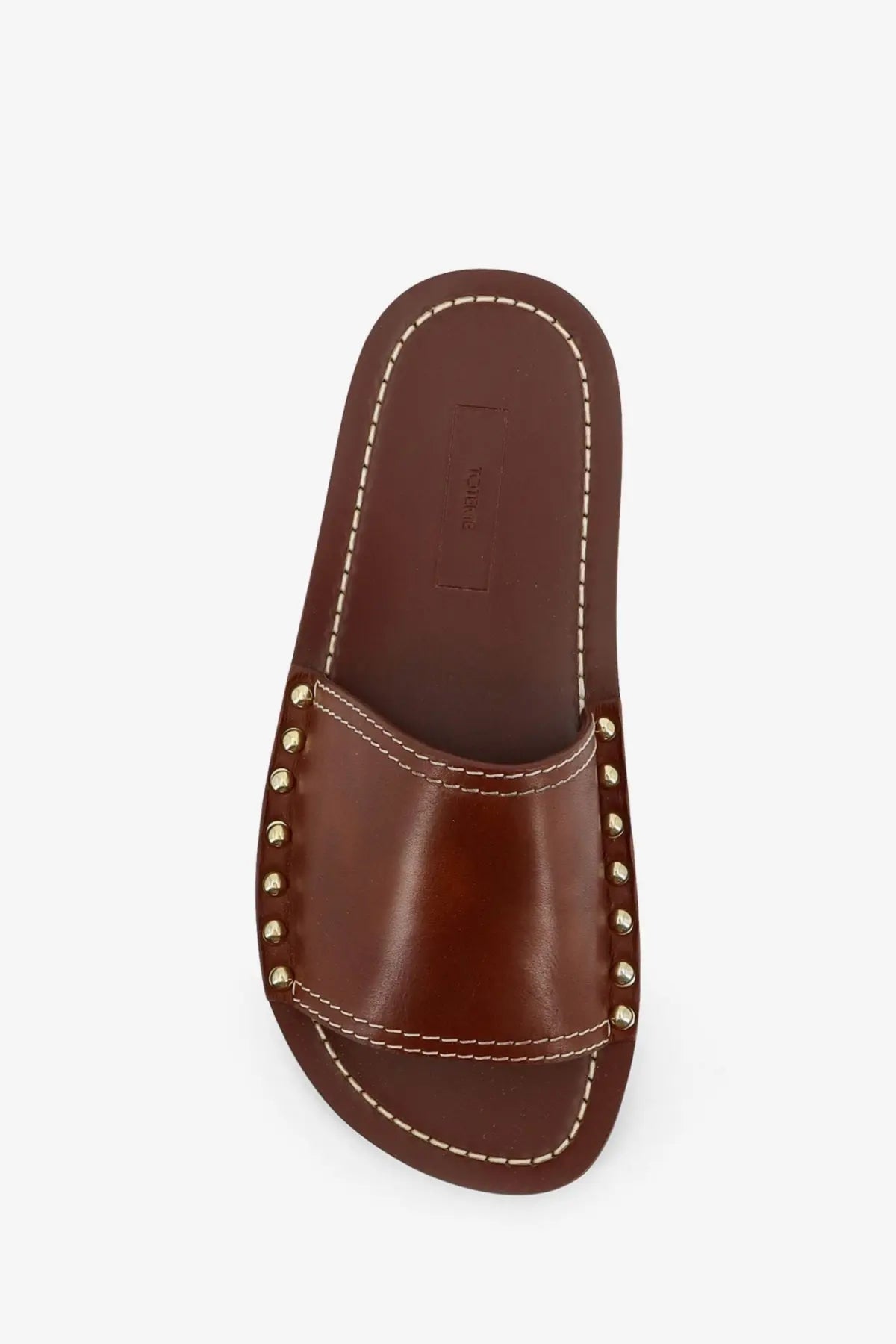 Toteme women’s brown leather slide sandal with gold-tone studs and contrasting white stitching on the strap