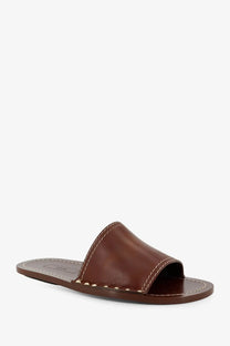 Toteme women’s low brown leather slide sandal with contrasting white stitching along the edges