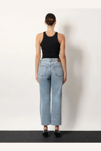 Toteme women’s low straight grey organic cotton jeans shown from the back with classic back pockets