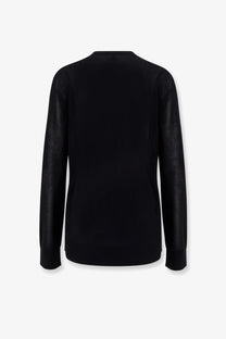 Toteme women’s lyocell sweater black with a sleek minimalist design and subtle textured detailing on the sleeves
