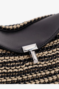 Toteme women’s mini lock clutch in black leather with black and beige woven strap and silver-tone t logo clasp