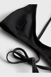 Toteme women’s black nylon satin triangle bikini top with adjustable tie straps for a customizable fit
