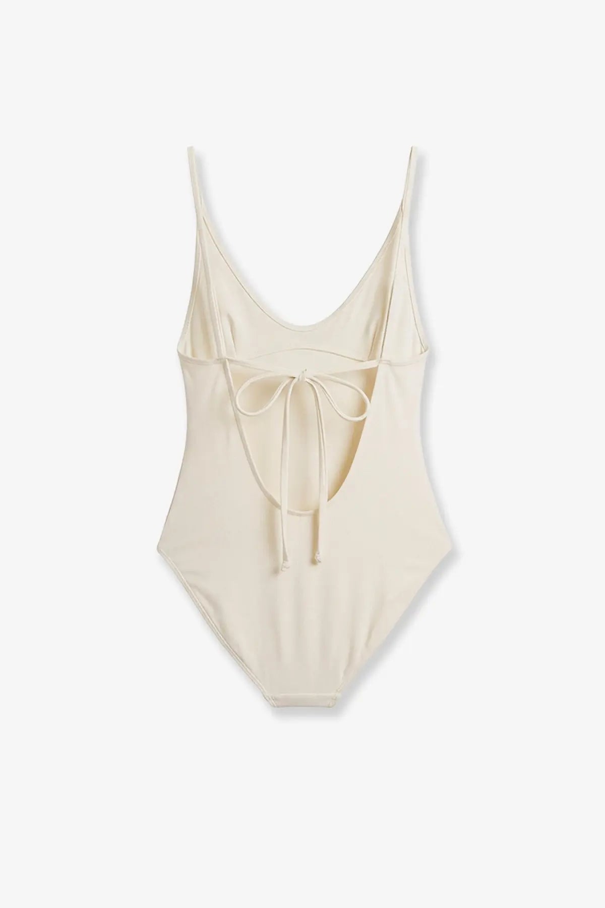 Cream-colored Toteme women’s nylon scoop one piece swimsuit with thin spaghetti straps and back tie detail shown from back