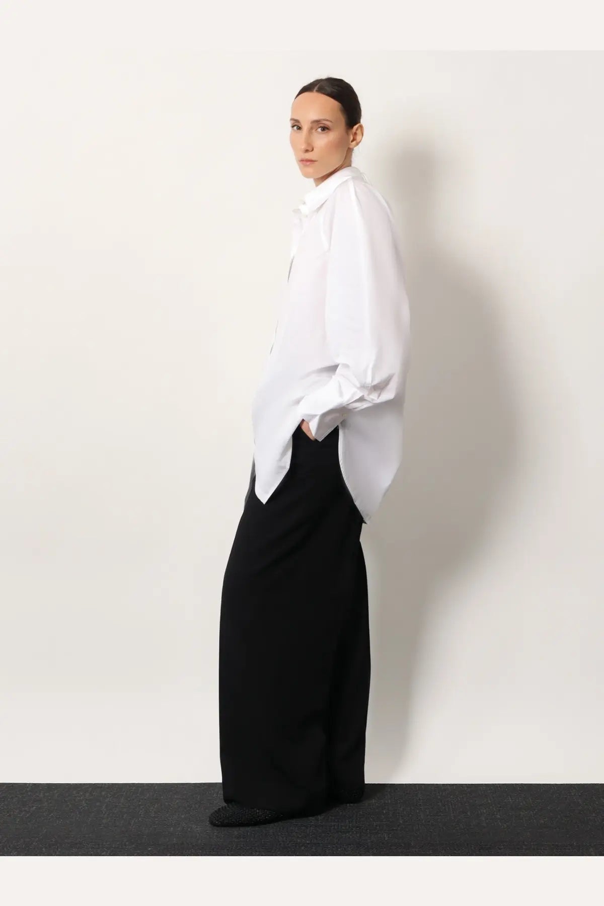 White oversized button-down shirt with loose flowing sleeves and relaxed fit made from organic cotton by toteme women