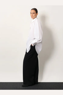 White oversized button-down shirt with loose flowing sleeves and relaxed fit made from organic cotton by toteme women