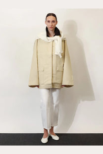 Toteme women’s beige organic cotton summer country jacket with utility style and plush white scarf over shoulders