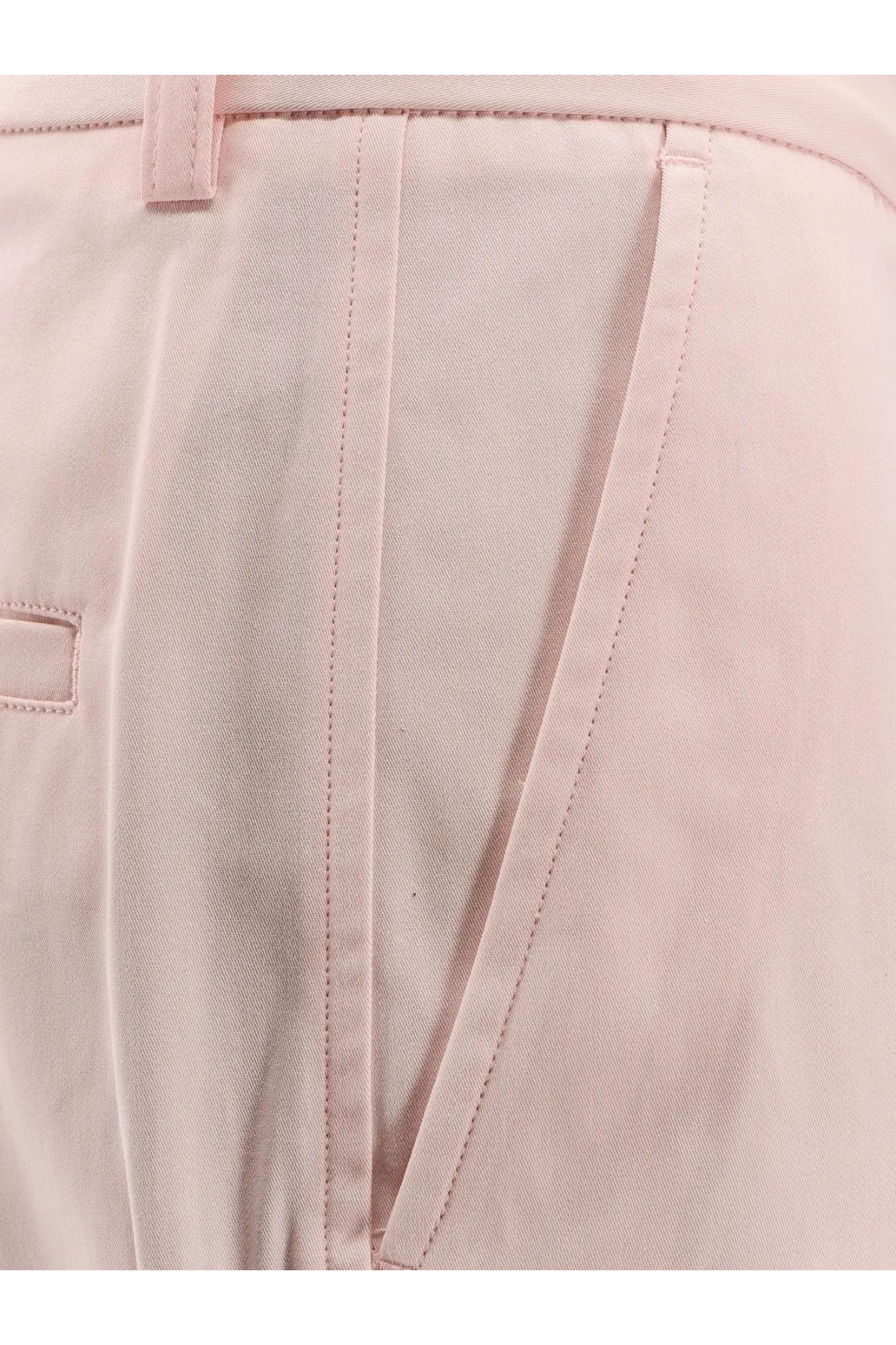 Toteme women’s organic cotton trousers in light pink chino fabric with subtle woven texture and matching stitching
