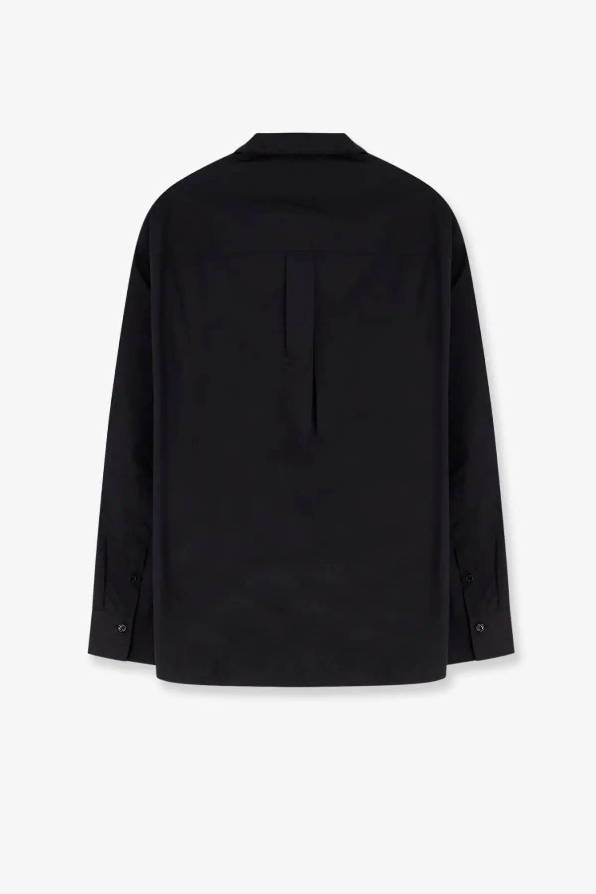 Back view of toteme women’s oversized black cotton shirt with subtle vertical seam and buttoned cuffs