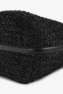 Toteme women’s black woven straw tote bag with sleek leather strap and raffia shoulder design for stylish carrying