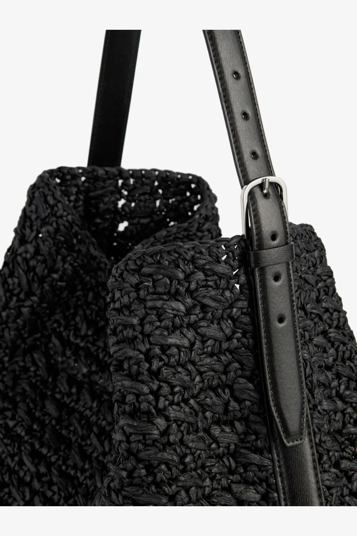 Toteme women’s black woven straw tote bag with leather straps and silver-toned buckle for shoulder carry
