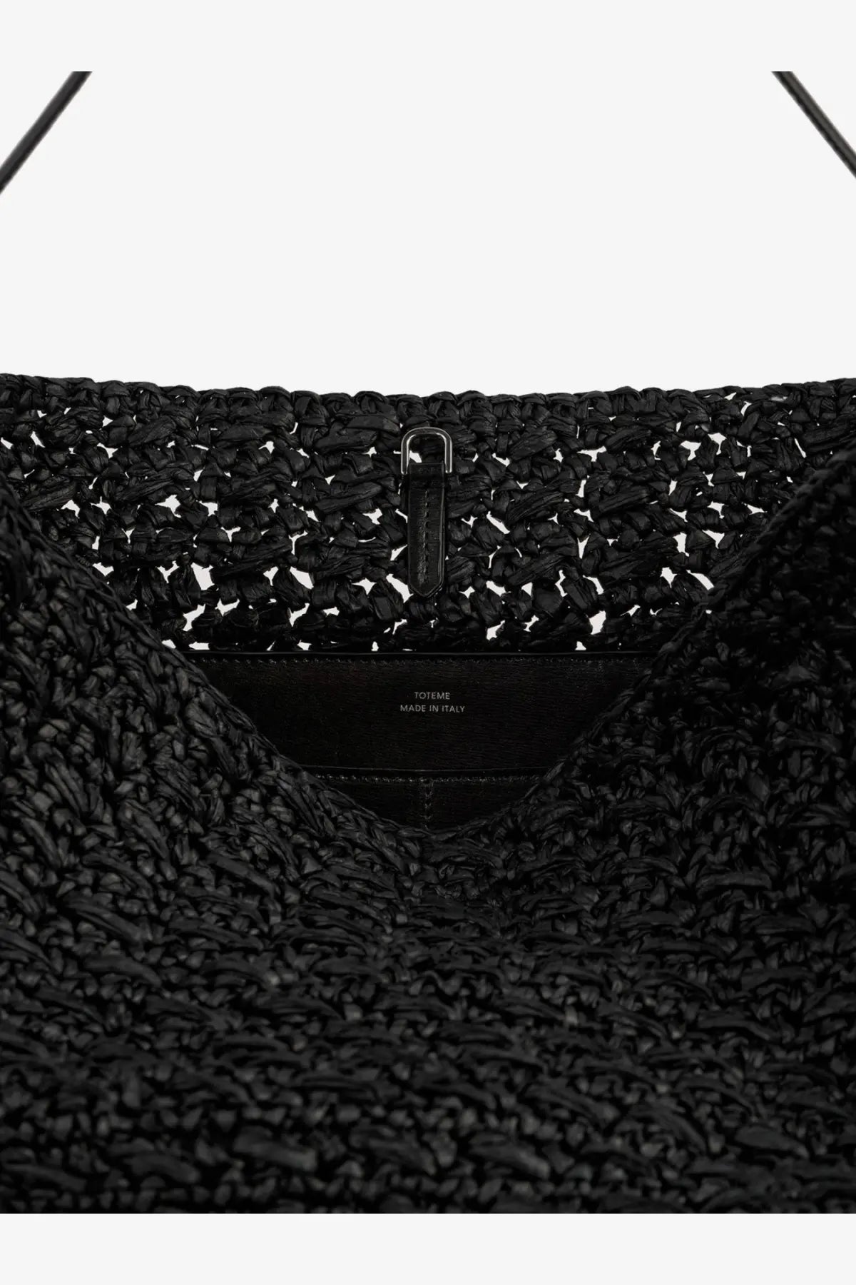 Toteme women’s raffia shoulder bag in black woven straw with sleek metal clasp and leather interior label
