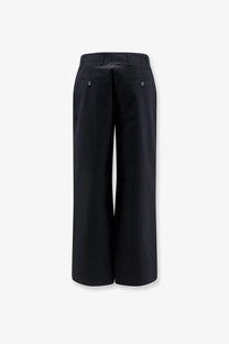 Toteme women’s black wide-leg cotton trousers with sleek tailored fit and metallic button-accented front pockets