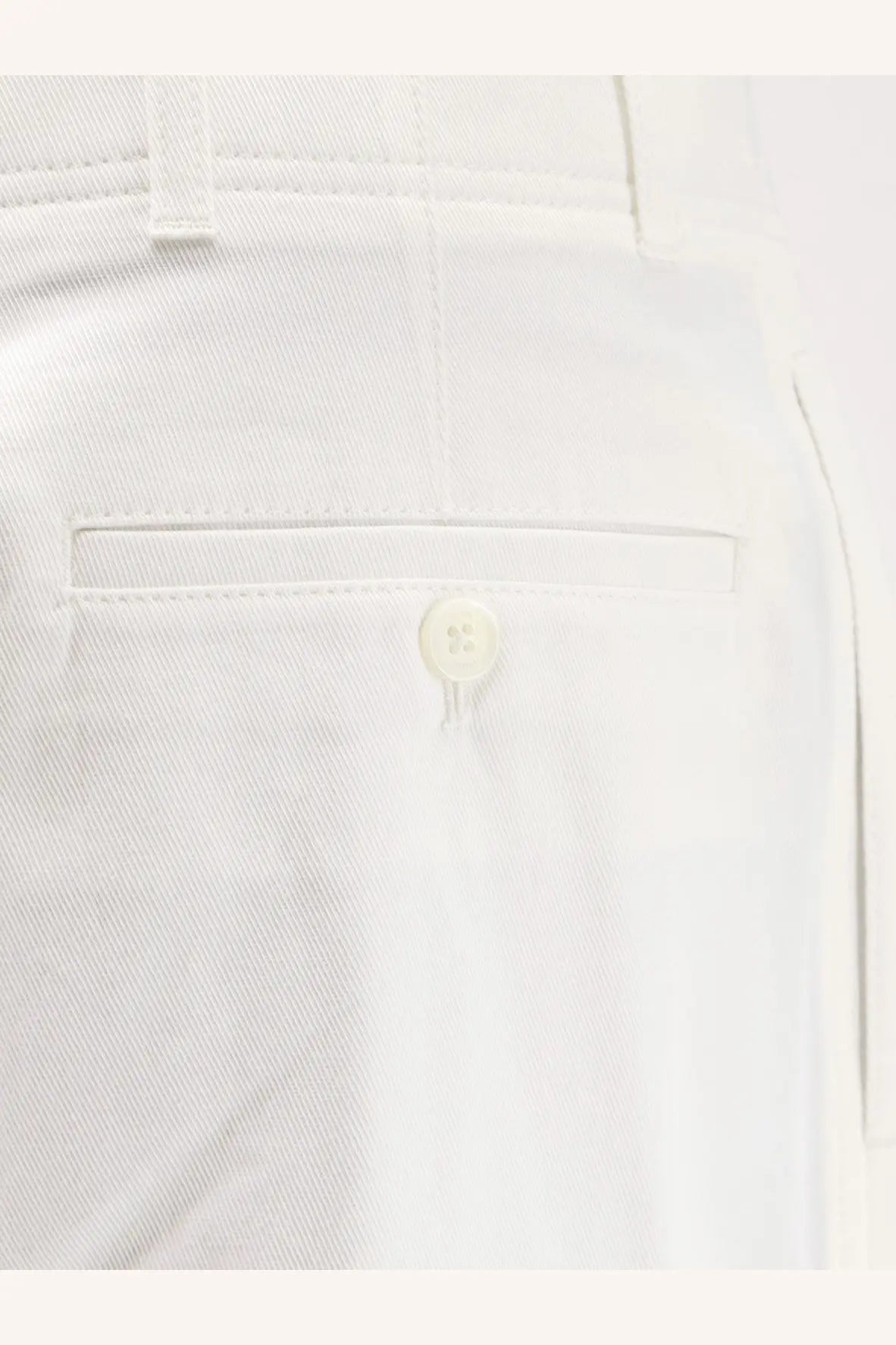 Toteme women’s relaxed white cotton trousers with subtle twill weave and single button closure