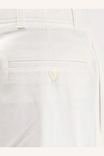 Toteme women’s relaxed white cotton trousers with subtle twill weave and single button closure