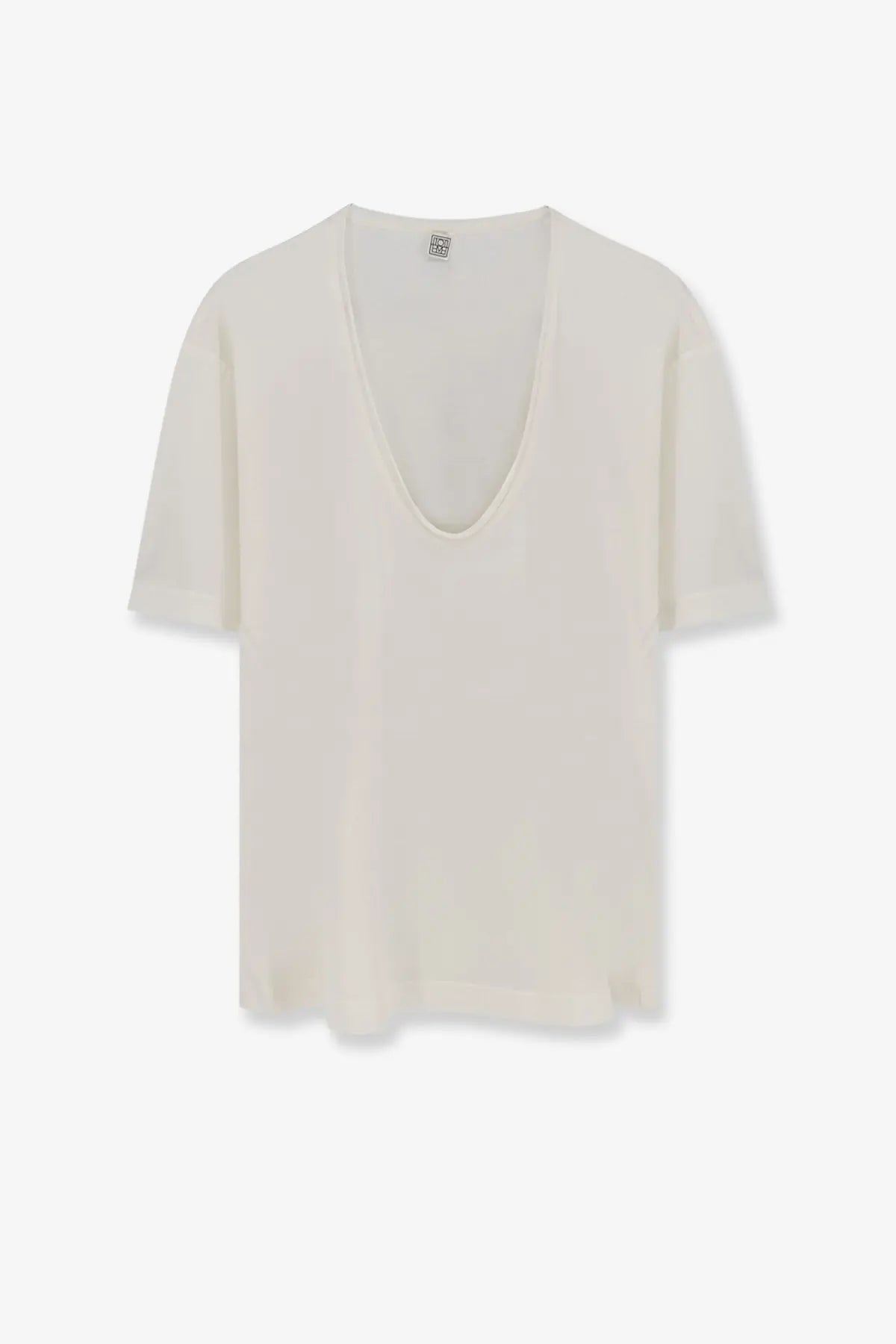 Cream-colored Toteme women’s silk and cotton blend lightweight short-sleeved top with deep v-neckline