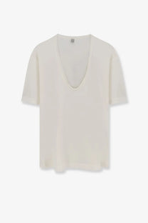 Cream-colored Toteme women’s silk and cotton blend lightweight short-sleeved top with deep v-neckline