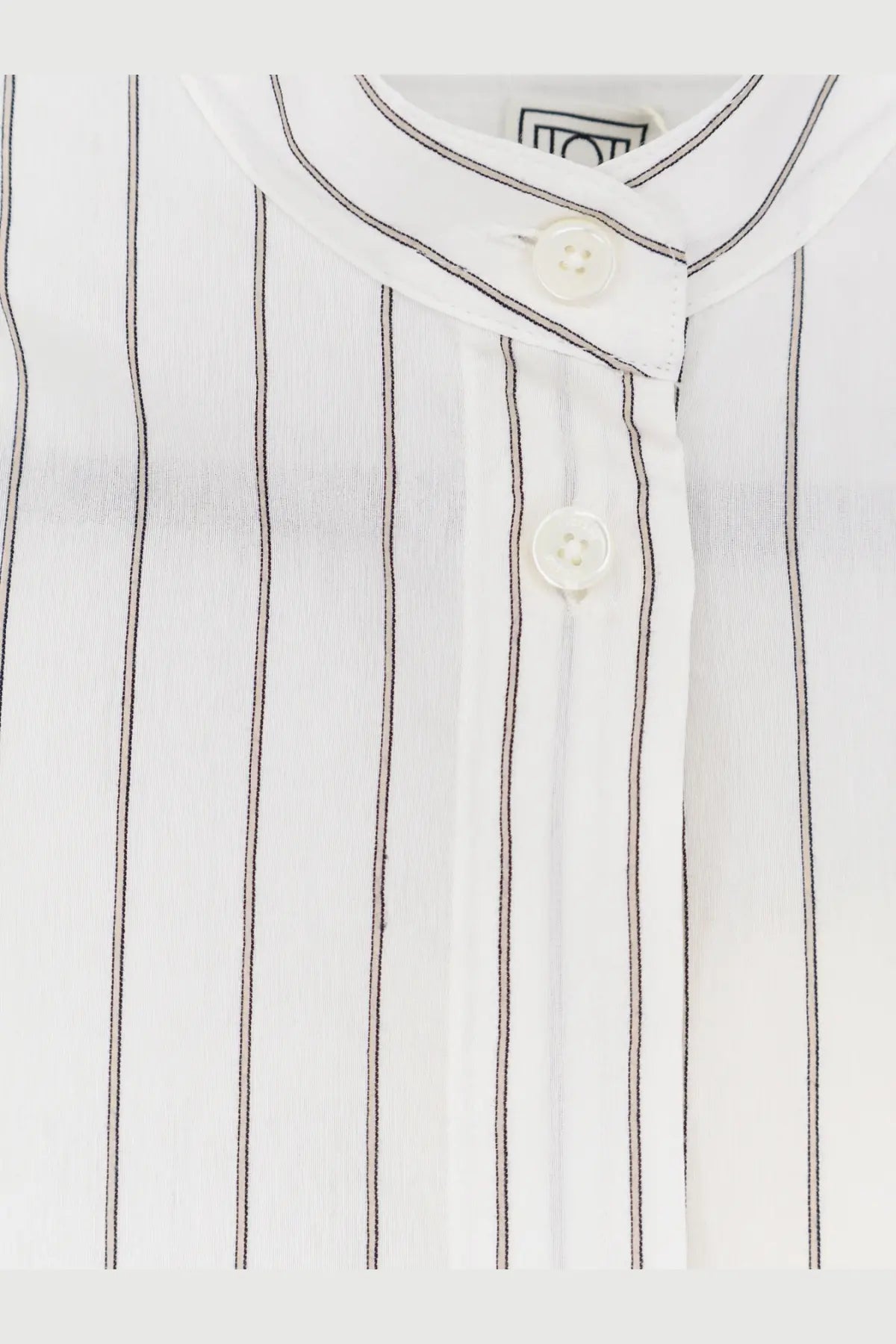 Toteme womens silk and cotton white dress featuring a white button-up blouse with thin black vertical stripes and textured fabric