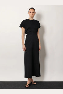 Toteme women’s black wool dress with short sleeves and slouch waistline in a minimalist design