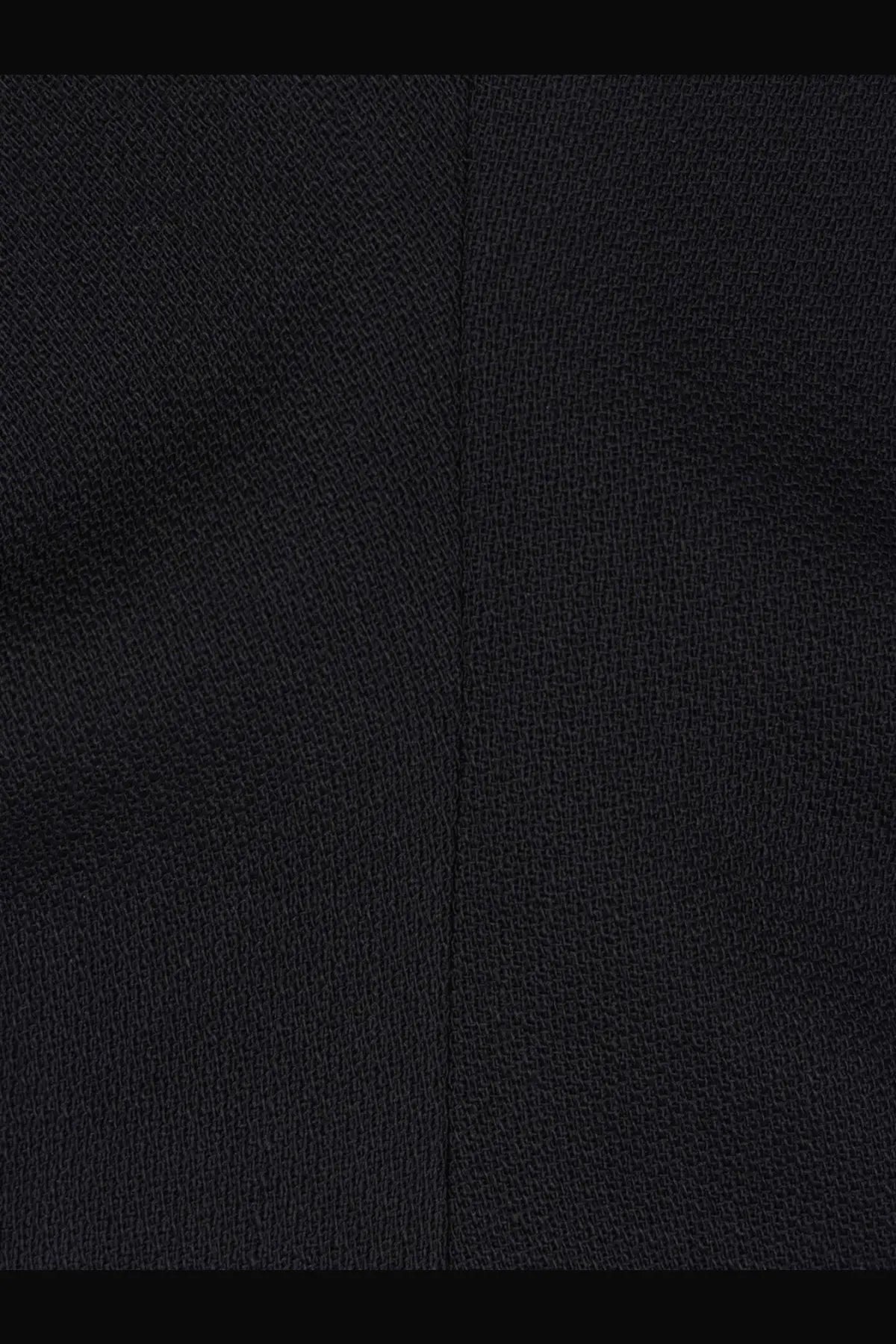 Toteme women’s slouch waist wool dress black shown with textured fabric and subtle woven pattern with central seam