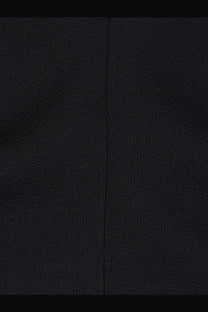 Toteme women’s slouch waist wool dress black shown with textured fabric and subtle woven pattern with central seam
