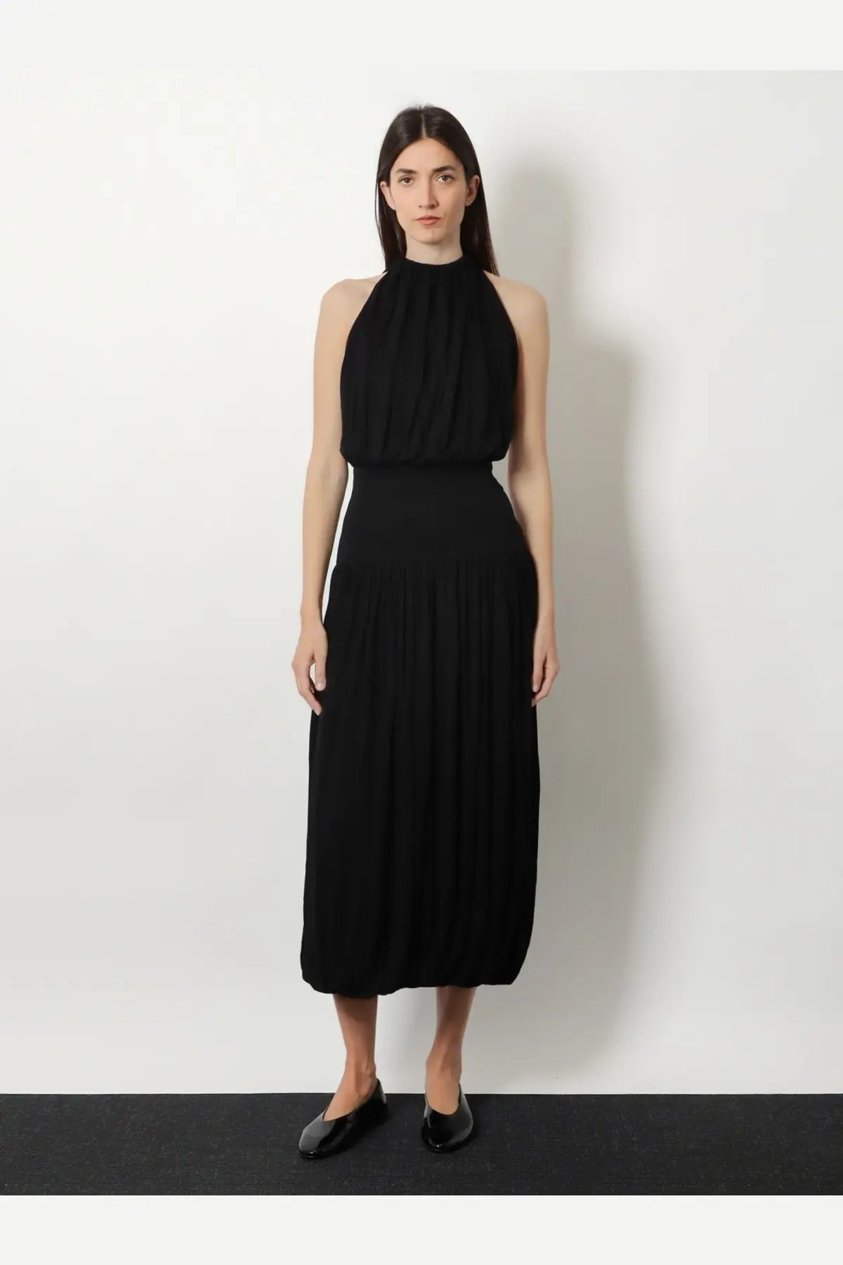 Toteme women’s black halter neck midi dress with soft gathered viscose bodice and pleated skirt