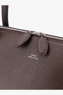 Toteme women’s brown suede tote bag with textured leather, silver zipper, and embossed made in Italy logo on front