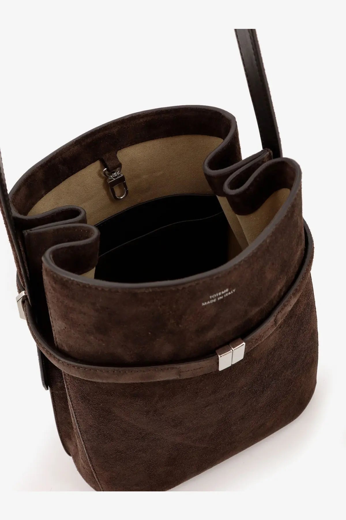 Toteme women’s brown suede shoulder bag with silver metal clasp and black leather strap for stylish use