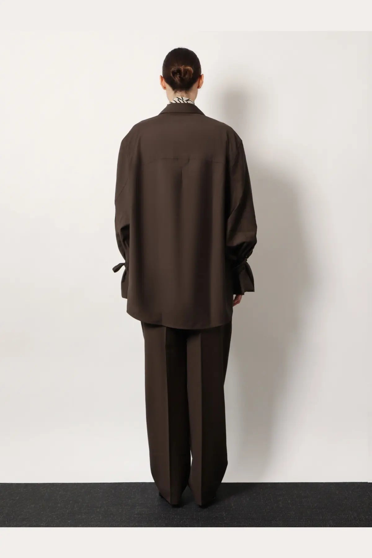 Toteme women’s grey wool shirt with oversized fit long sleeves and tie cuffs featuring a subtle collar