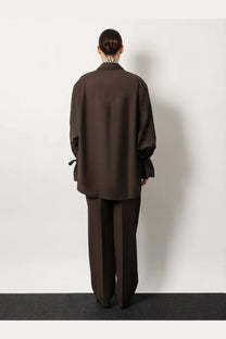 Toteme women’s grey wool shirt with oversized fit long sleeves and tie cuffs featuring a subtle collar
