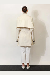 Toteme women’s trench washed cotton beige cream-colored trench coat with structured layered design and black buckle cuffs