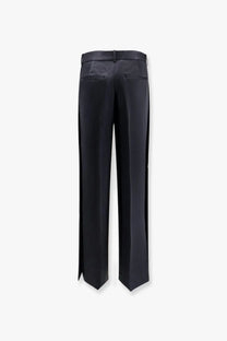 Toteme women’s black viscose blend trousers with sleek straight-leg cut and subtle side slits at the hem