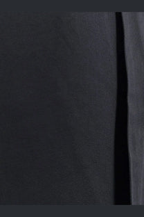 Toteme women’s viscose blend trouser in black with soft black suede fabric featuring a smooth, textured surface and subtle sheen