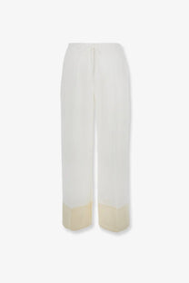Cream-colored toteme women’s viscose wide-leg trousers with a subtle gradient fade to lighter beige at the hem