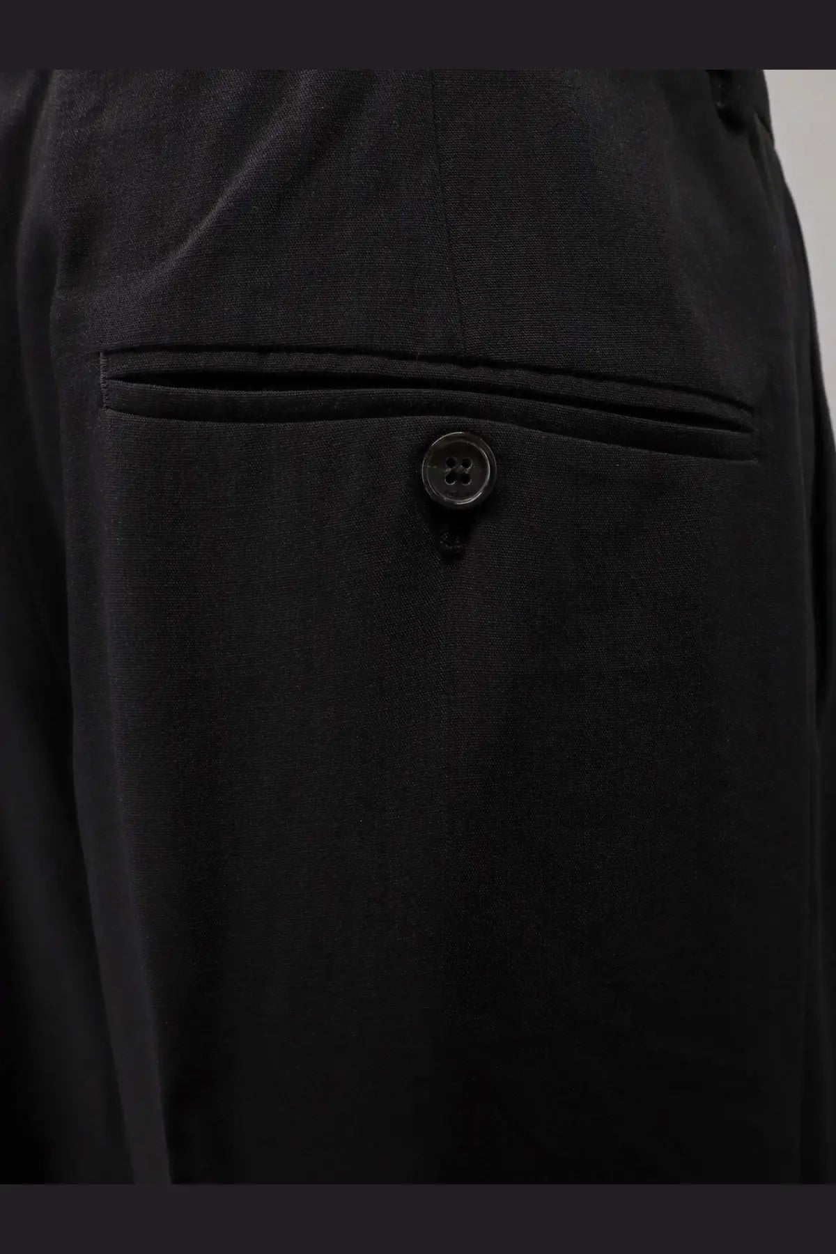 Toteme women’s black viscose and wool trousers with dark-wash denim fabric and black buttoned front pocket detail